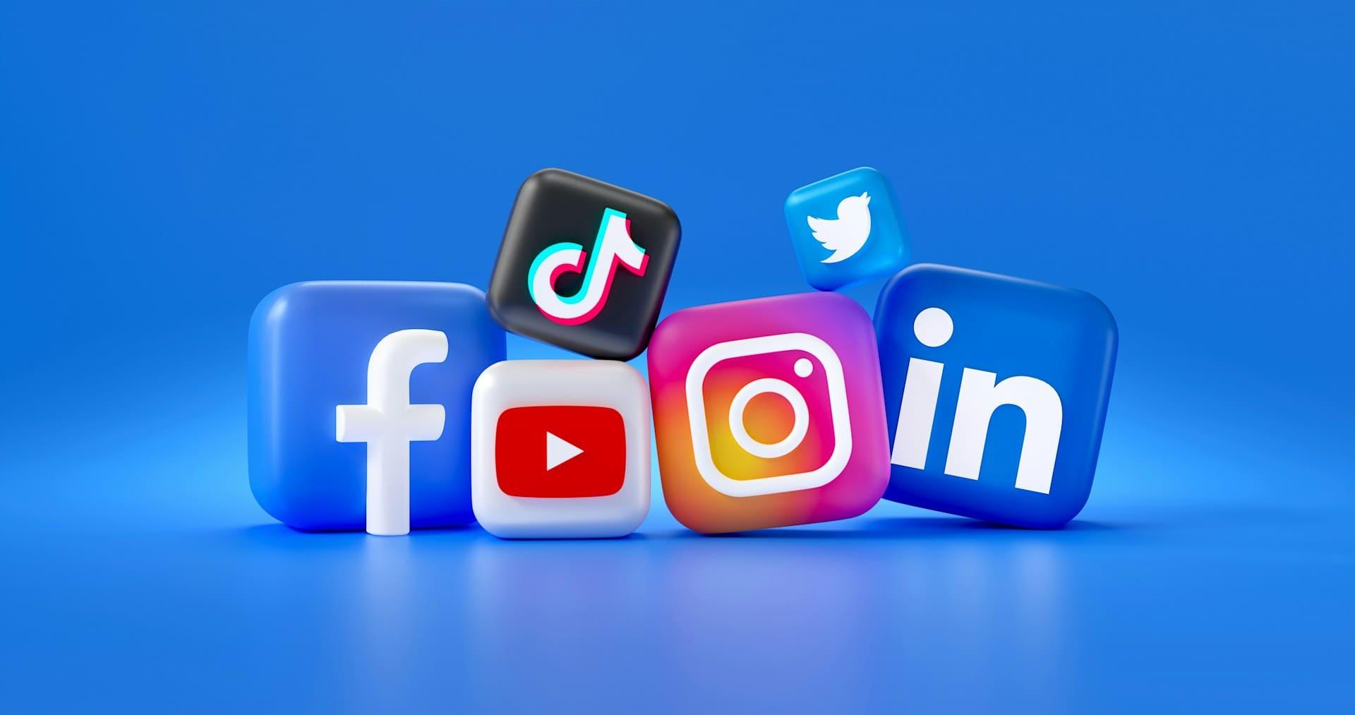 Social media icons displayed on a blue background, featuring popular platforms like Facebook, Twitter, and Instagram.